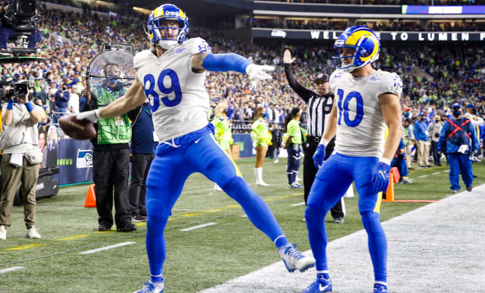 Los Angeles Rams tight end Tyler Higbee (89) celebrates with wide receiver Cooper Kupp (10) after catching a touchdown pass against the Seattle Seahawks during the third quarter at Lumen Field.